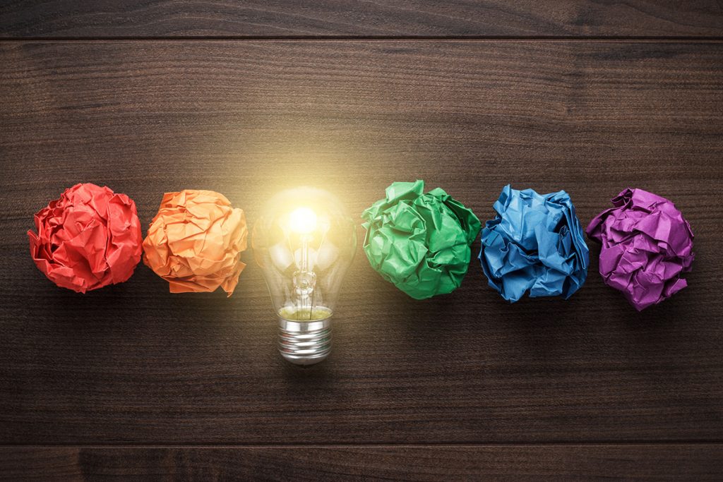 lightbulb with rainbow crumpled paper