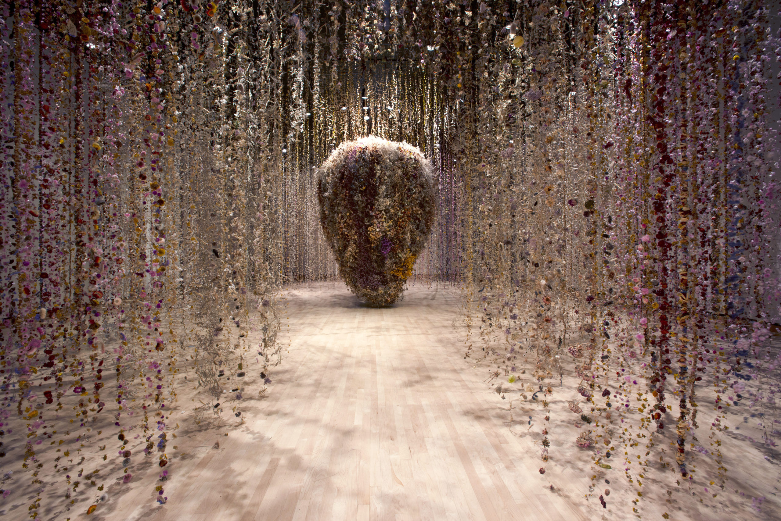 An installation by Rebecca Louise Law made of thousands of fried flowers suspended from the ceiling.