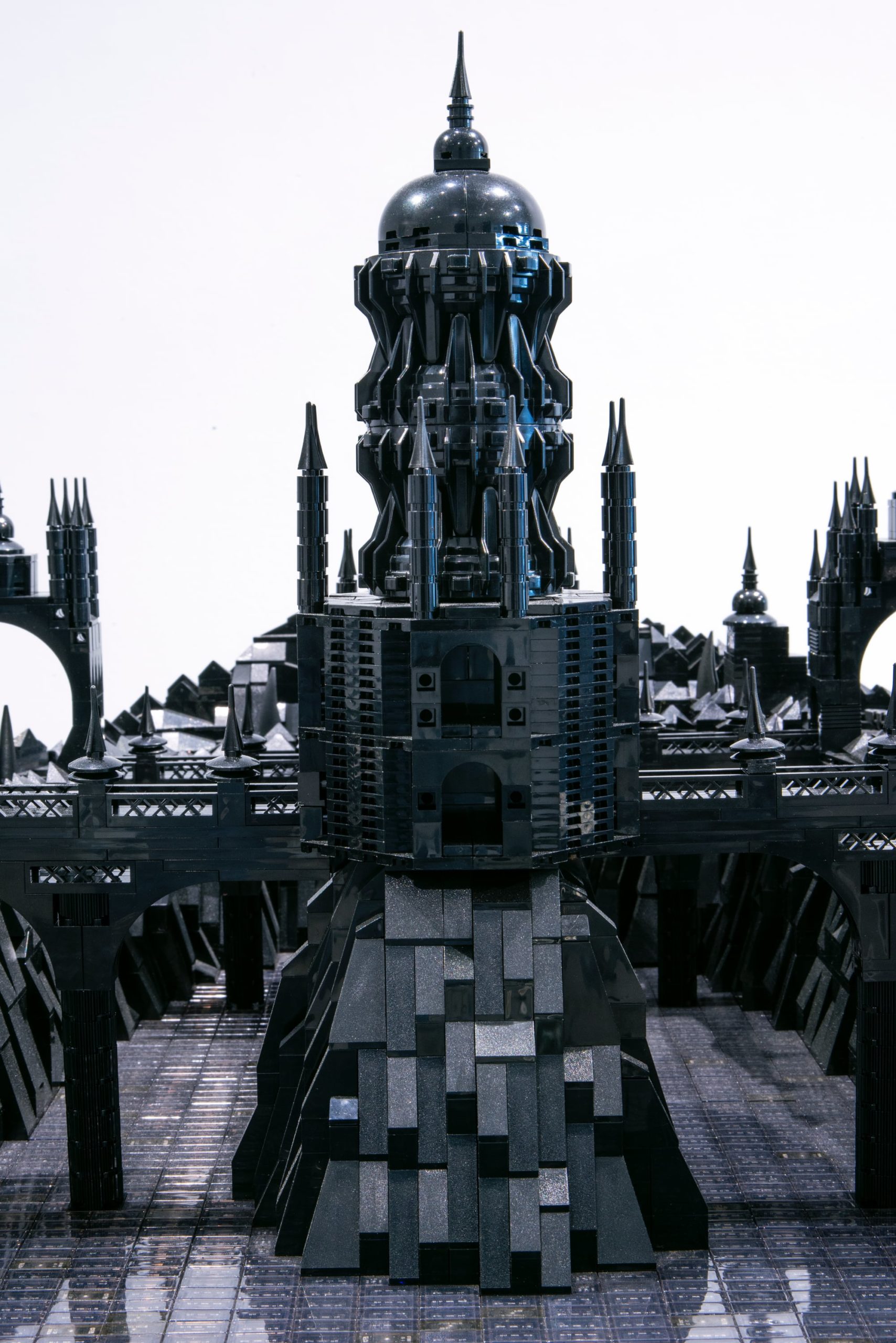 A photo of a detailed cityscape made of black LEGO