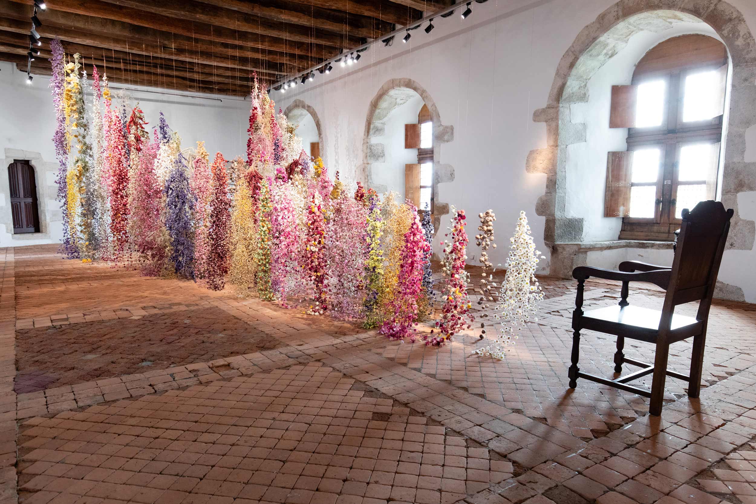 An installation by Rebecca Louise Law in the dining hall of a château.
