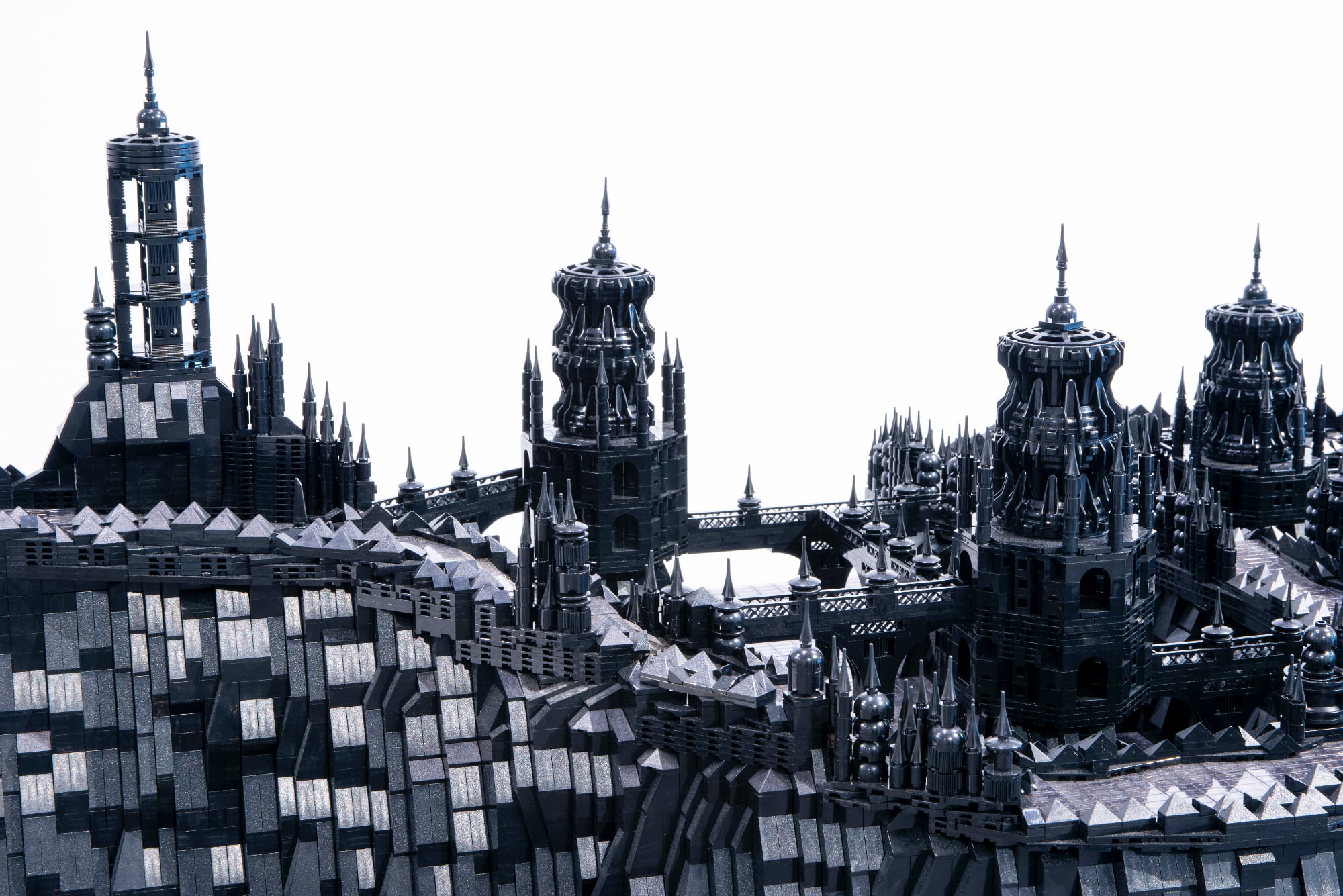 A photo of a detailed cityscape made of black LEGO